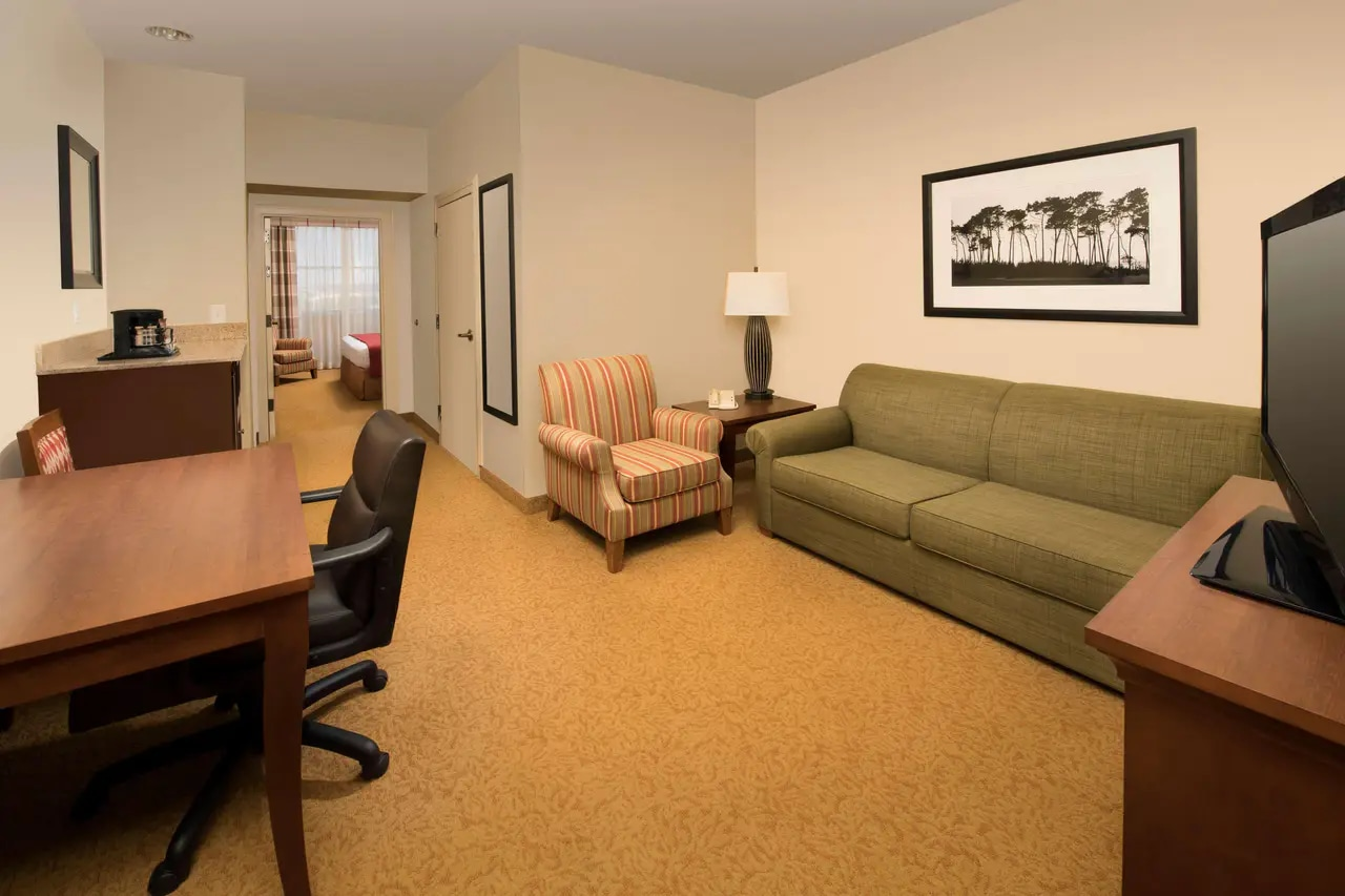 King bed and room amenities at Country Inn & Suites by Radisson, Humble IAH East